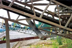 Unguarded return rollers over walkways&nbsp;can fall and produce a serious hazard. (Pictures: © 2023 Martin Engineering)
