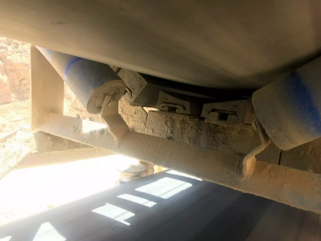 Fig. 5: Impact bar wear nearing the aluminium track. Note the centre roller has fallen away indicating it too is taking impact. This has furthered wear on the centre bars.
