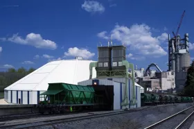 Hopper bottom railcar discharge to circular storage.
