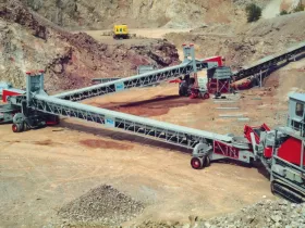 Self propelled mobile link conveyors for a track mounted face crusher.
