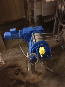 The bespoke electric winch used for the safe and smooth lifting and lowering of a large telescopic export chute.