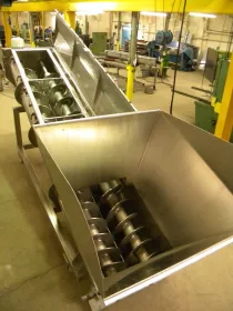 An Ajax twin screw feeder previously supplied to improve throughput, handling and inspection of pork rind at Essentia. (Picture: Ajax Equipment Ltd.)

